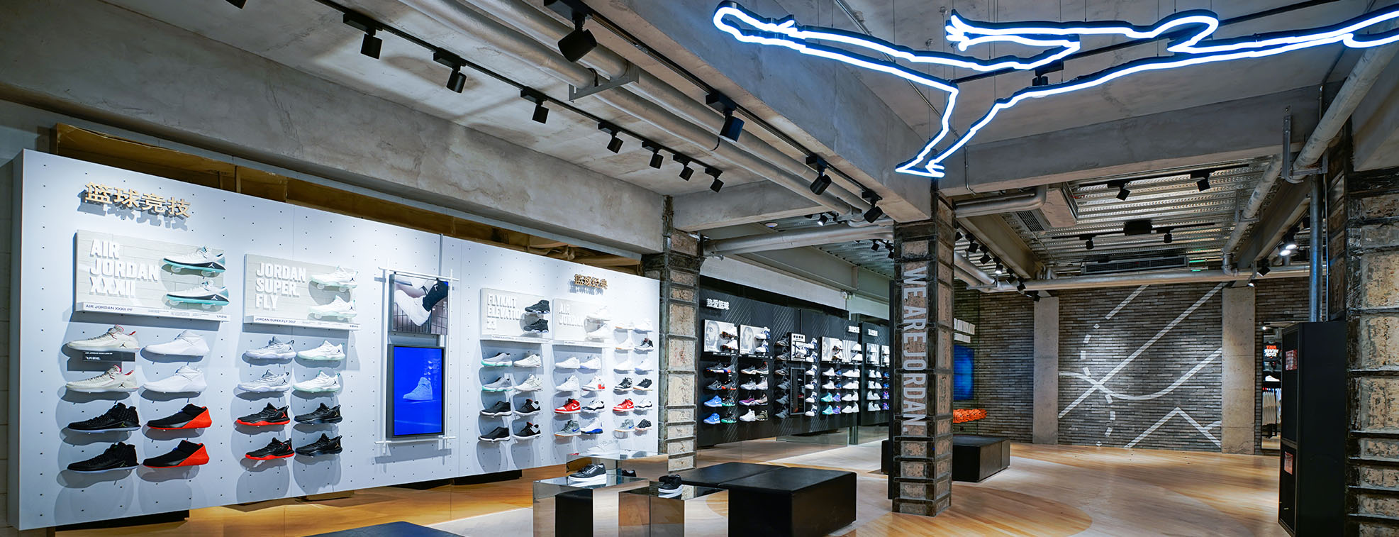 Sport shoe shop with chairs and numerous shelves