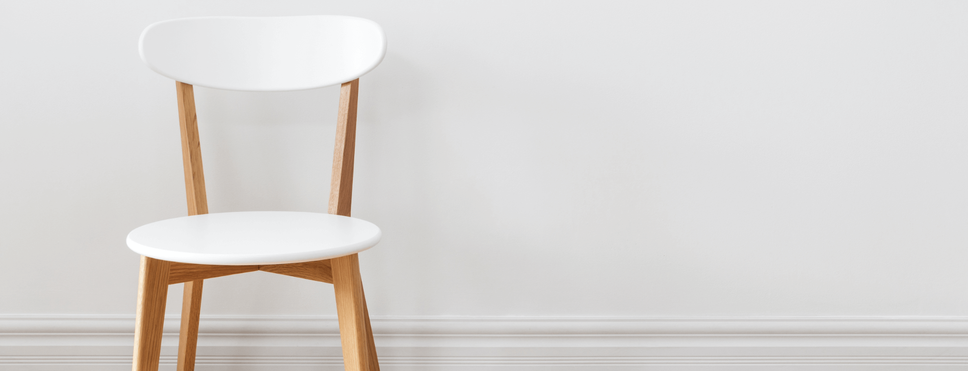 Traditional looking white chair on a white background