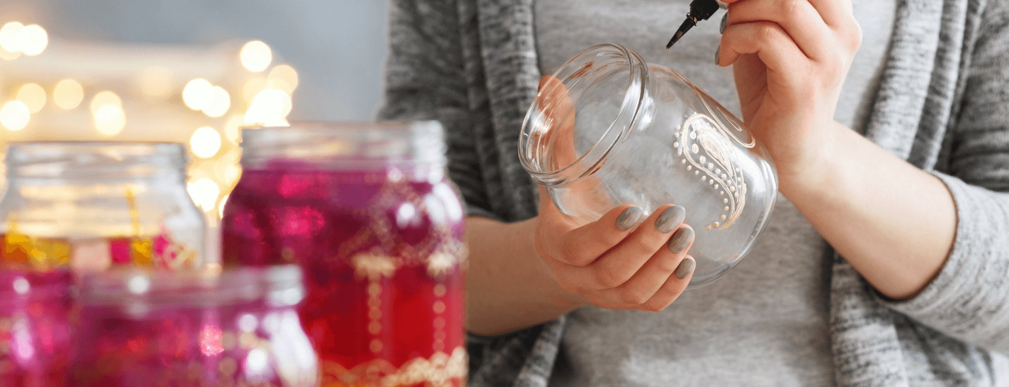 A woman creating DIY mason jar to decorate her room with